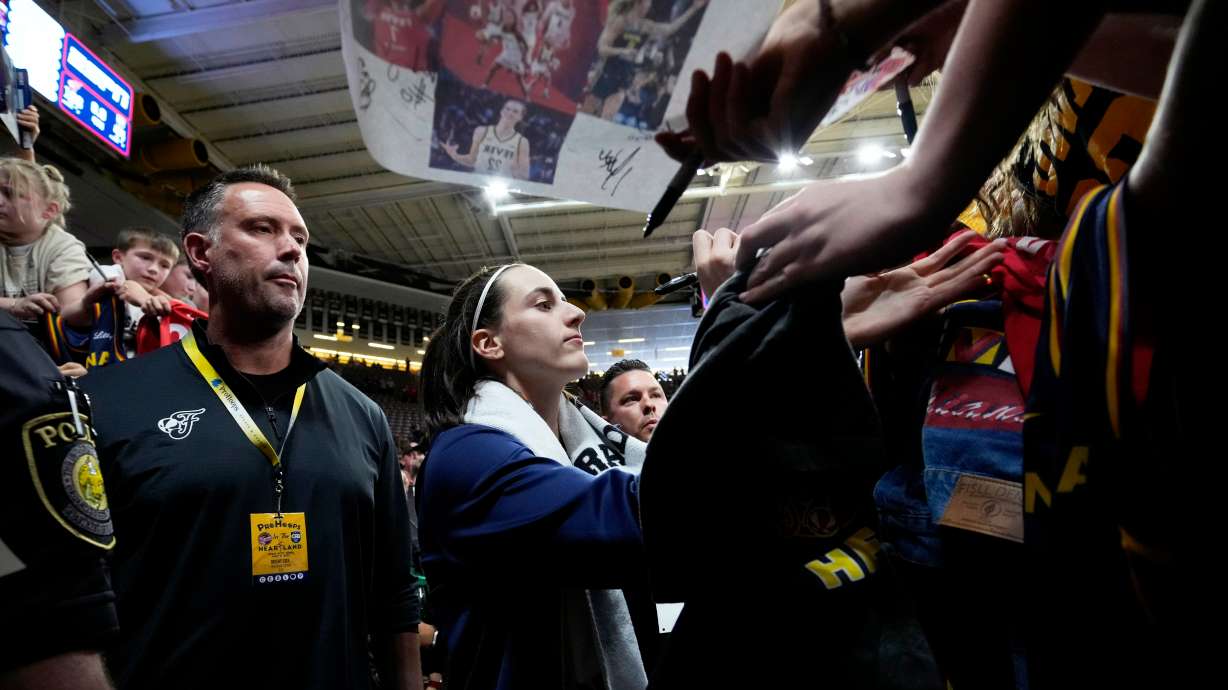Indiana Fever guard Caitlin Clark signs autographs after an exhibition women's basketball game against Brazil, Sunday, May 4, 2025, in Iowa City, Iowa.