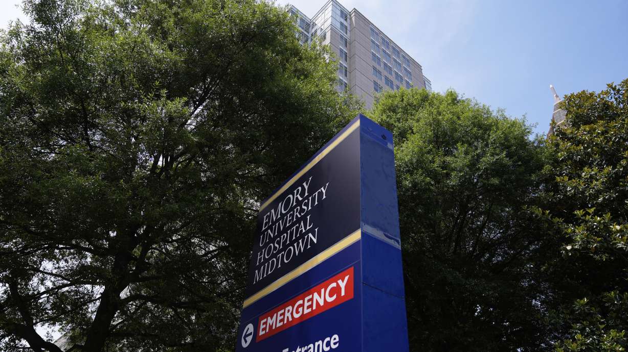 Emory University Hospital Midtown is pictured on Thursday in Atlanta. The case of a brain-dead pregnant woman in Georgia on life support is raising complicated questions about abortion law and whether a fetus is a person.