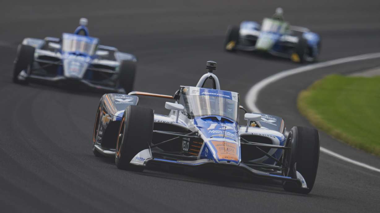 Kyle Larson drives through the first turn during practice for the Indianapolis 500 auto race at Indianapolis Motor Speedway in Indianapolis, Thursday, May 15, 2025.