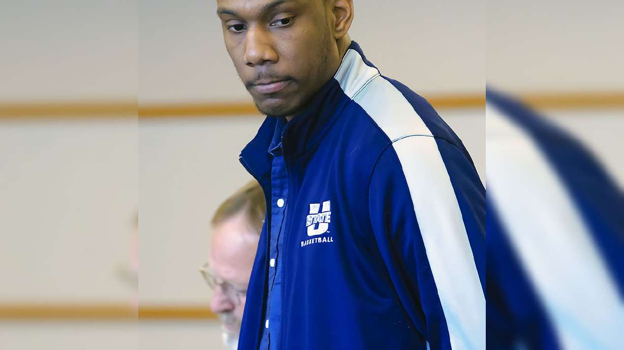 Jarred Shaw, who played basketball for Utah State, stands next to his lawyer Shannon Demler, in 1st District Court on March 17, 2014, in Logan. He was arrested in Indonesia May 7 on drug charges.