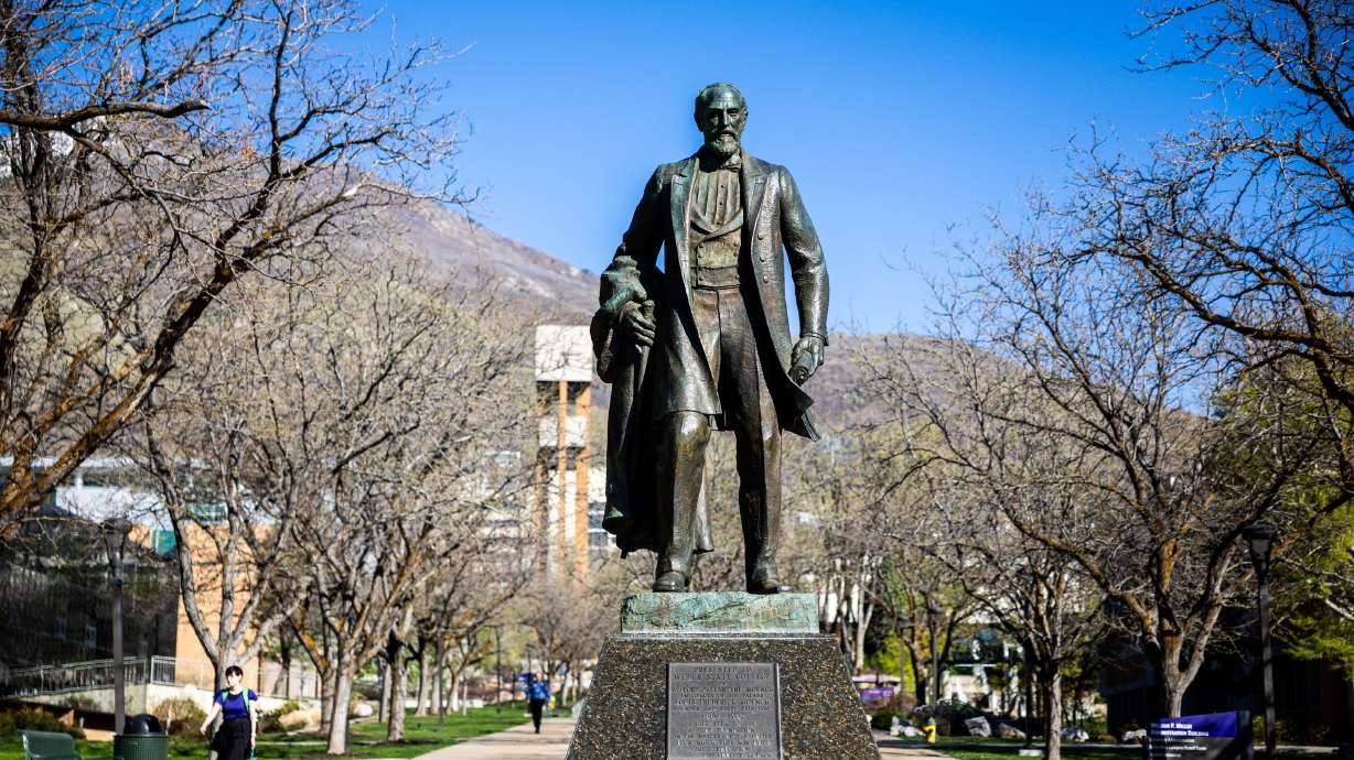 Students walk on campus near a statue of Louis Frederick Moench at Weber State University in Ogden on April 14. Weber State has developed a tool for people to create wills.