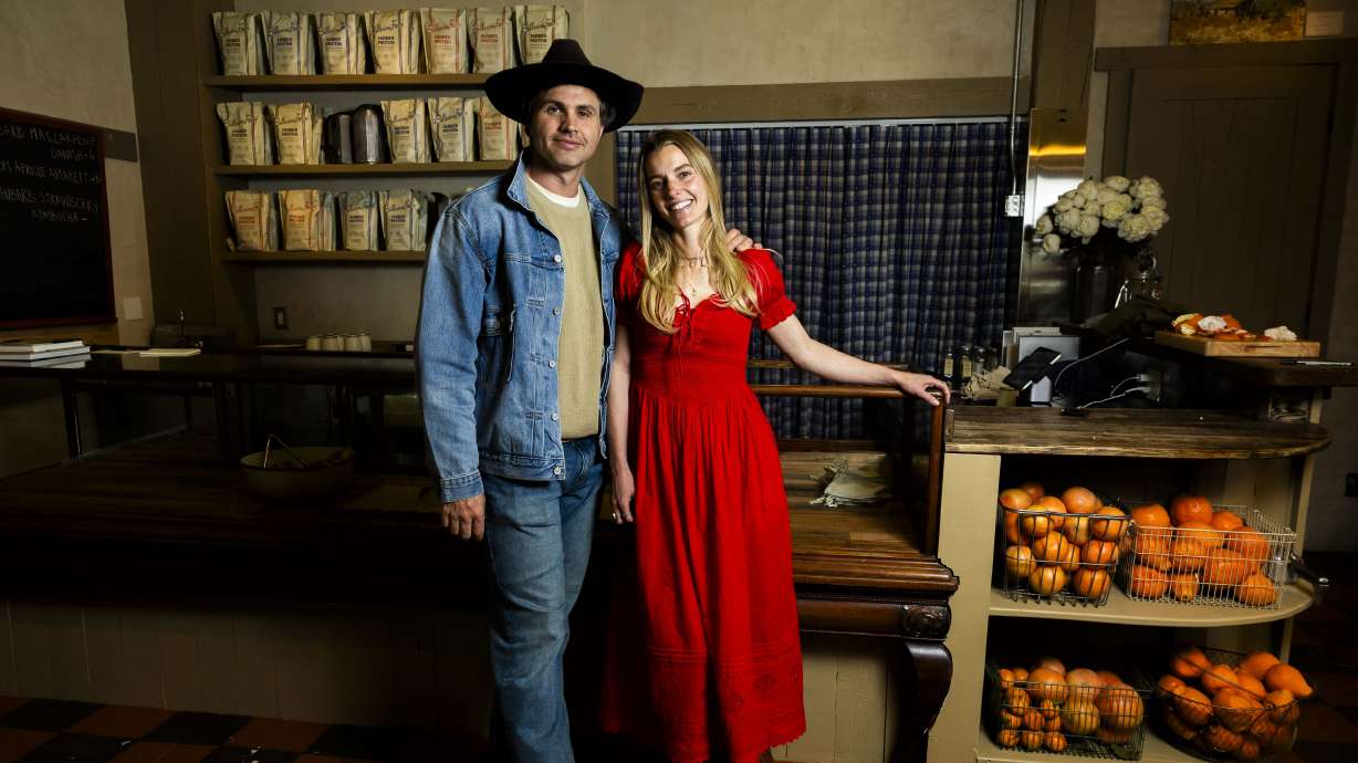 Ballerina Farm owners Daniel Neeleman and Hannah Neeleman pose for a portrait at the counter of their new farm store during a media day for Ballerina Farm’s new farm store in Midway on Friday.