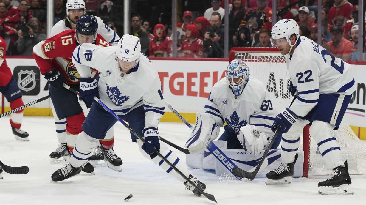 Toronto Maple Leafs center Steven Lorentz (18) goes for the puck against Florida Panthers center Anton Lundell (15) during the first period in Game 6 of a second-round NHL hockey playoff series, Friday, May 16, 2025, in Sunrise, Fla.