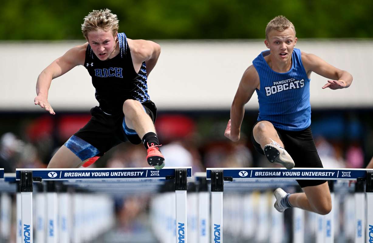 Rich’s Jasper Johnson and Panguich’s Caleb Cox battle to the line in the 1A 110m hurdles during state track Day 1 for 4A, 3A, 2A and 1A at BYU in Provo on Friday, May 16, 2025.