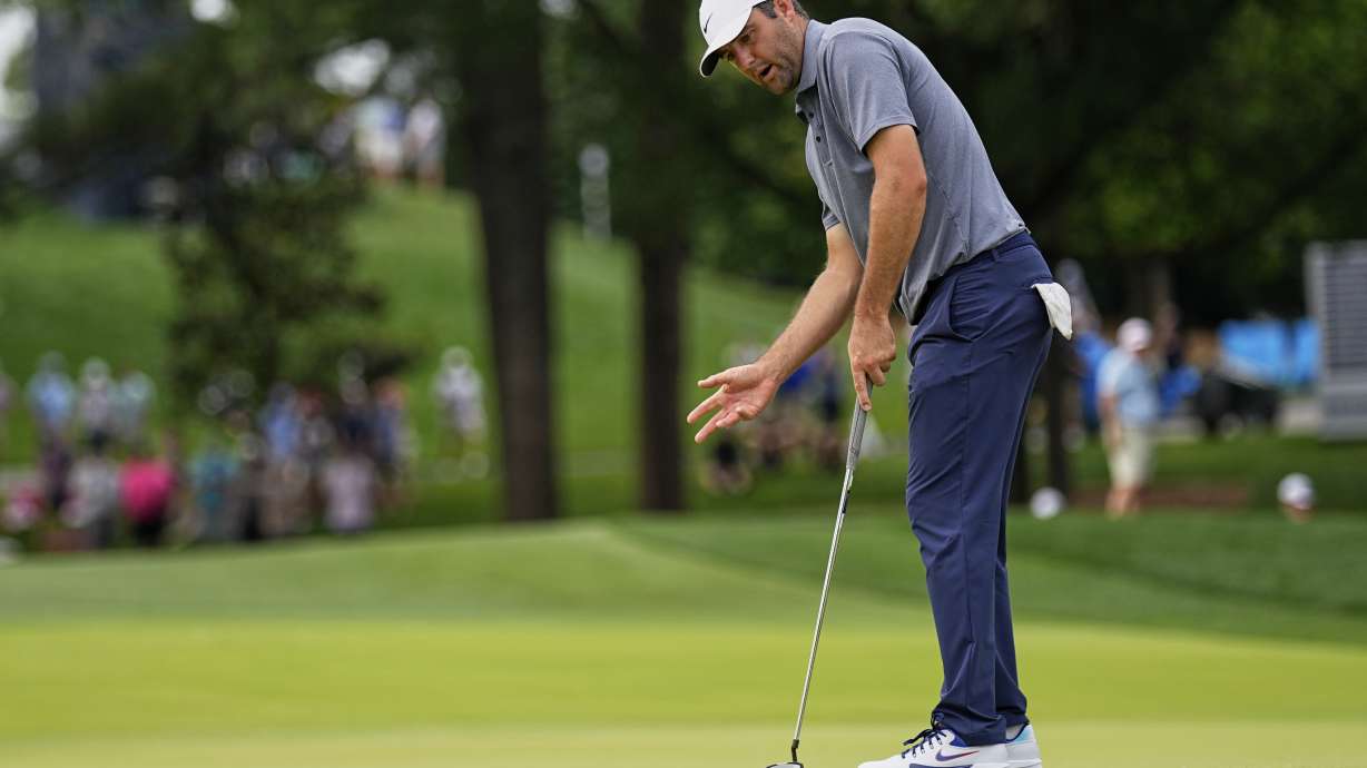 Scottie Scheffler reacts after missing a putt on the 10th hole during the second round of the PGA Championship golf tournament at the Quail Hollow Club, Friday, May 16, 2025, in Charlotte, N.C.