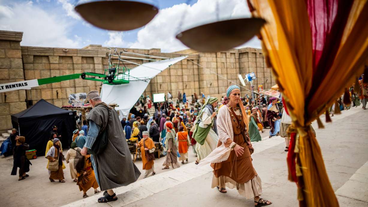 Extras act in the background on the set of "The Chosen" in Goshen, Utah County, on Tuesday.