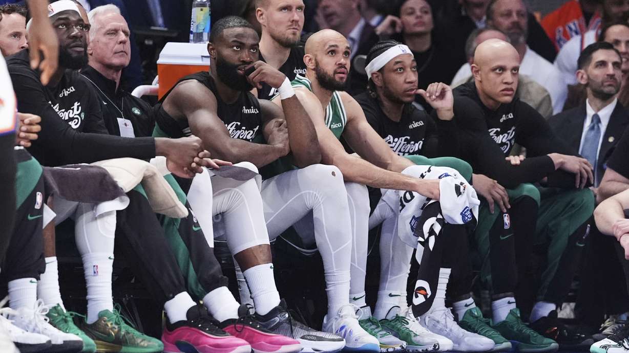 Boston Celtics' Jaylen Brown, third from left, watches with teammates during the second half of Game 6 in the Eastern Conference semifinals of the NBA basketball playoffs against the New York Knicks Friday, May 16, 2025, in New York.