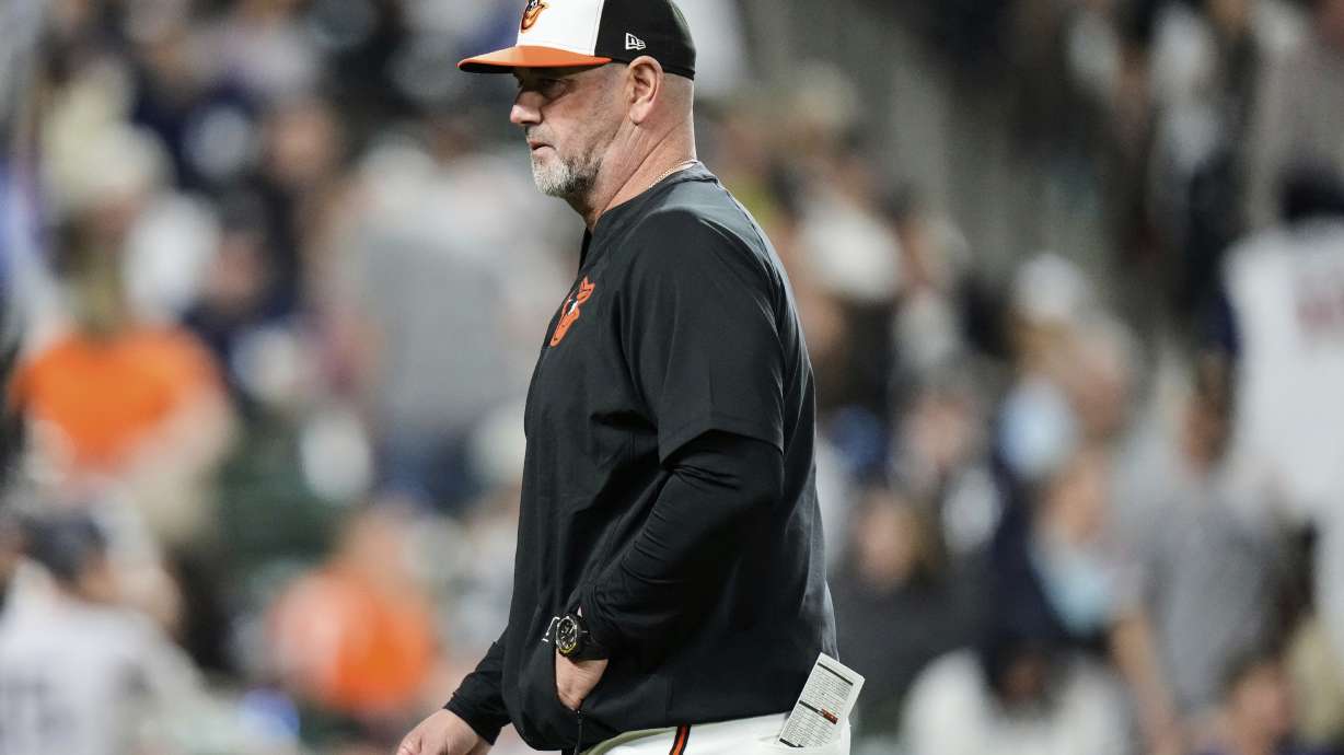 Baltimore Orioles manager Brandon Hyde returns to the dugout after making a pitching change during the seventh inning of a baseball game against the New York Yankees, Monday, April 28, 2025, in Baltimore.