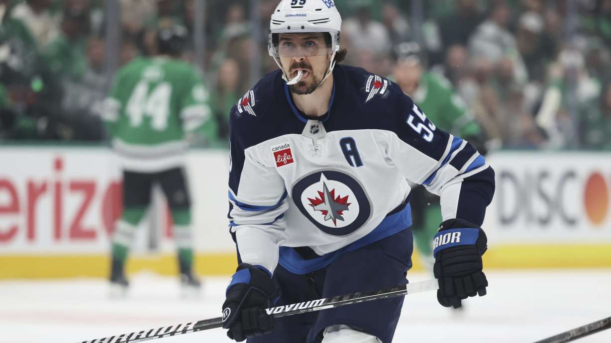 Winnipeg Jets center Mark Scheifele moves to the puck in the first period of Game 4 of a second-round NHL hockey playoff series against the Dallas Stars in Dallas, Tuesday, May 13, 2025.