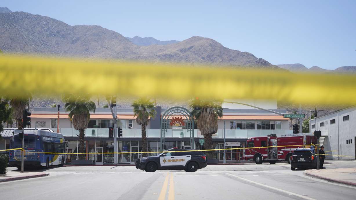 Police tape is placed across a street after an explosion Saturday in Palm Springs, Calif., that damaged a fertility clinic and left at least one person dead, authorities said, in what the FBI was calling an "intentional act of terrorism."