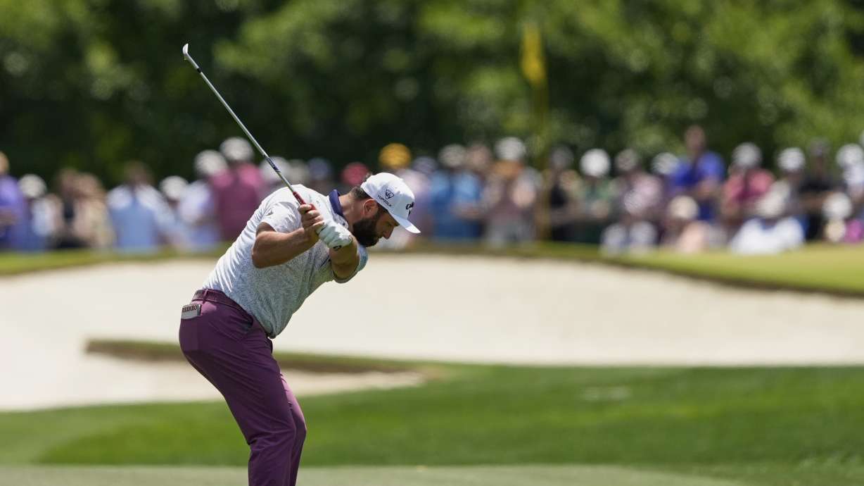 Jon Rahm, of Spain, hits from the fairway on the fifth hole during the third round of the PGA Championship golf tournament at the Quail Hollow Club, Saturday, May 17, 2025, in Charlotte, N.C.