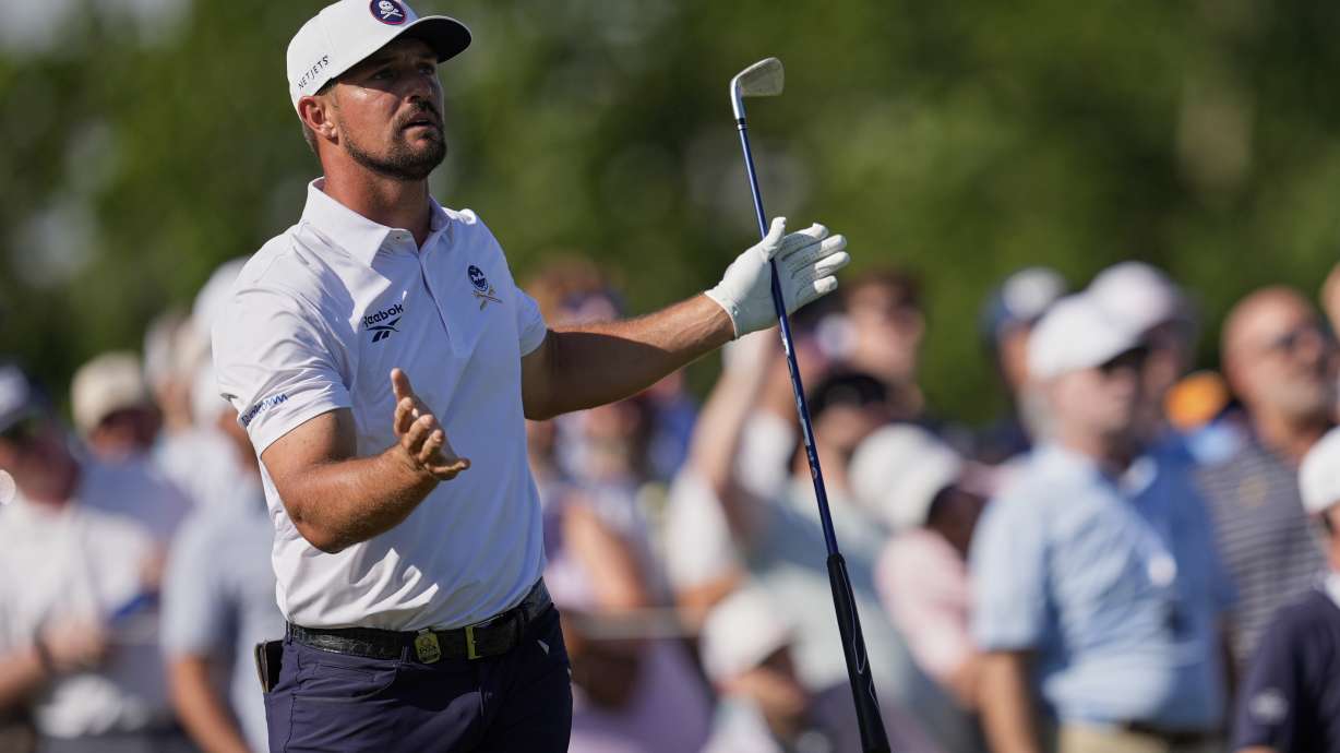 Bryson DeChambeau reacts after hitting his tee shot into the water on the 17th hole during the third round of the PGA Championship golf tournament at the Quail Hollow Club, Saturday, May 17, 2025, in Charlotte, N.C.