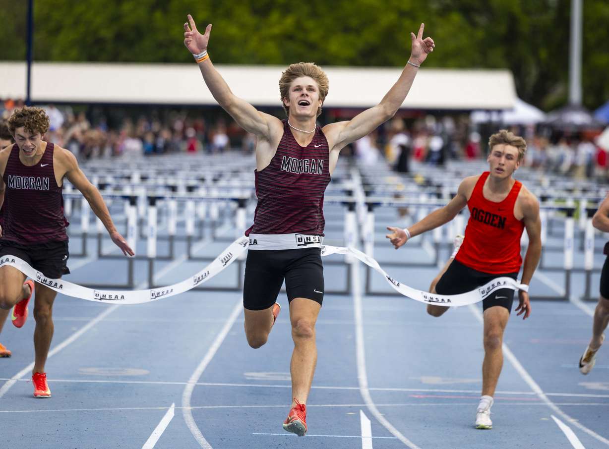 Morgan’s Kenneth Whitmer celebrates crossing the finish line in first in the 3A boys 110m hurdles during the 3A state track and field championship at the Clarence F. Robison Outdoor Track & Field at BYU in Provo on Saturday, May 17, 2025.