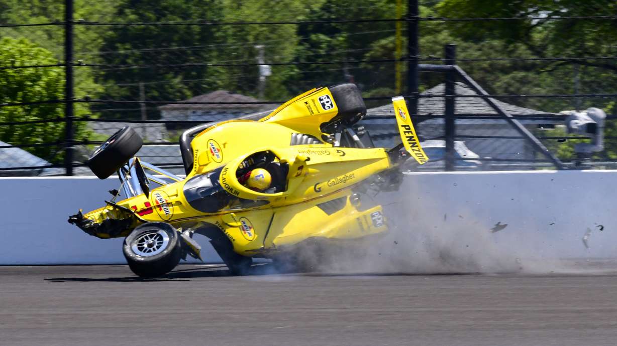 The car driven by Scott McLaughlin, of New Zealand, becomes airborne after hitting the wall in the second turn during practice for the Indianapolis 500 auto race at Indianapolis Motor Speedway in Indianapolis, Sunday, May 18, 2025.