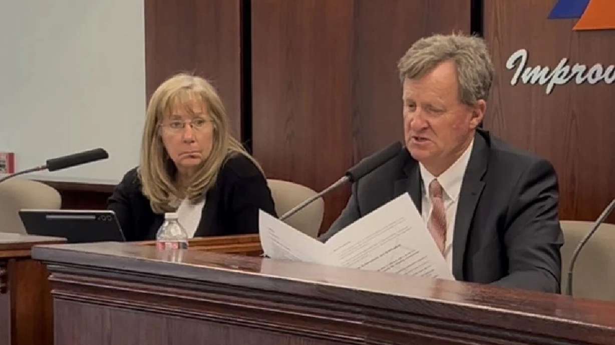 From left, Washington County School Board Vice President LaRene Cox looks on as President David Stirland discusses the district's personal device policy draft in St. George, May 12.