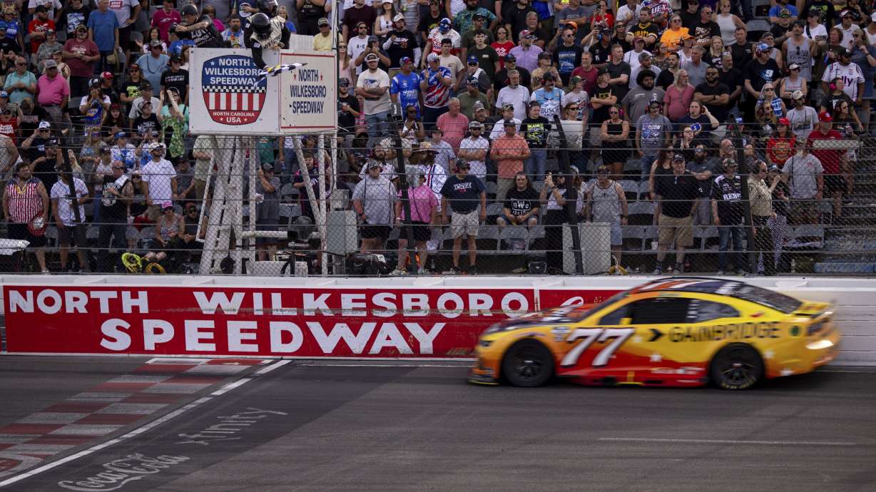 Carson Hocevar gets the checkered flag in the NASCAR All-Star Open auto race Sunday, May 18, 2025, in North Wilkesboro, N.C.