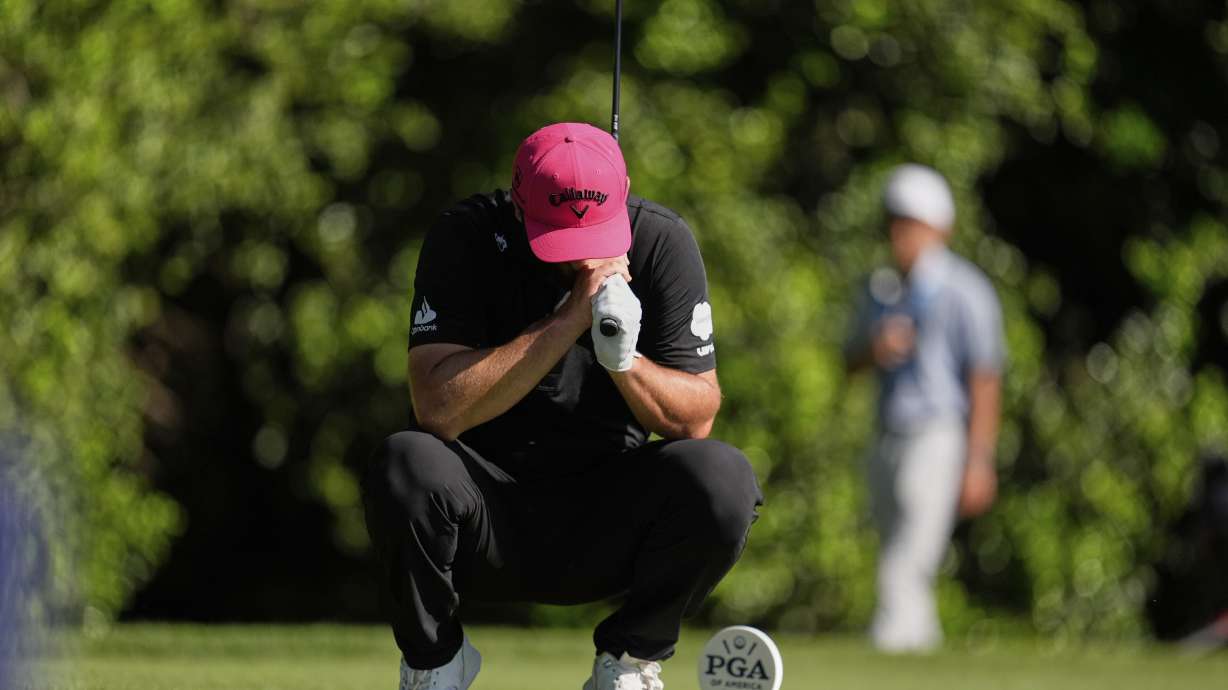 Jon Rahm, of Spain, reacts to his tee shot on the 14th hole during the final round of the PGA Championship golf tournament at the Quail Hollow Club, Sunday, May 18, 2025, in Charlotte, N.C.