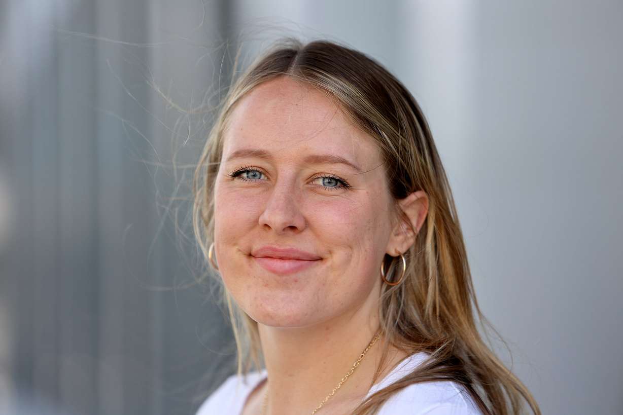 Megan Akar poses for a photo outside of the Wallace F. Bennett Federal Building where she works in Salt Lake City on May 1. Akar keeps a running tab with the Tacos El Potosino food truck to pay for meals for homeless people.