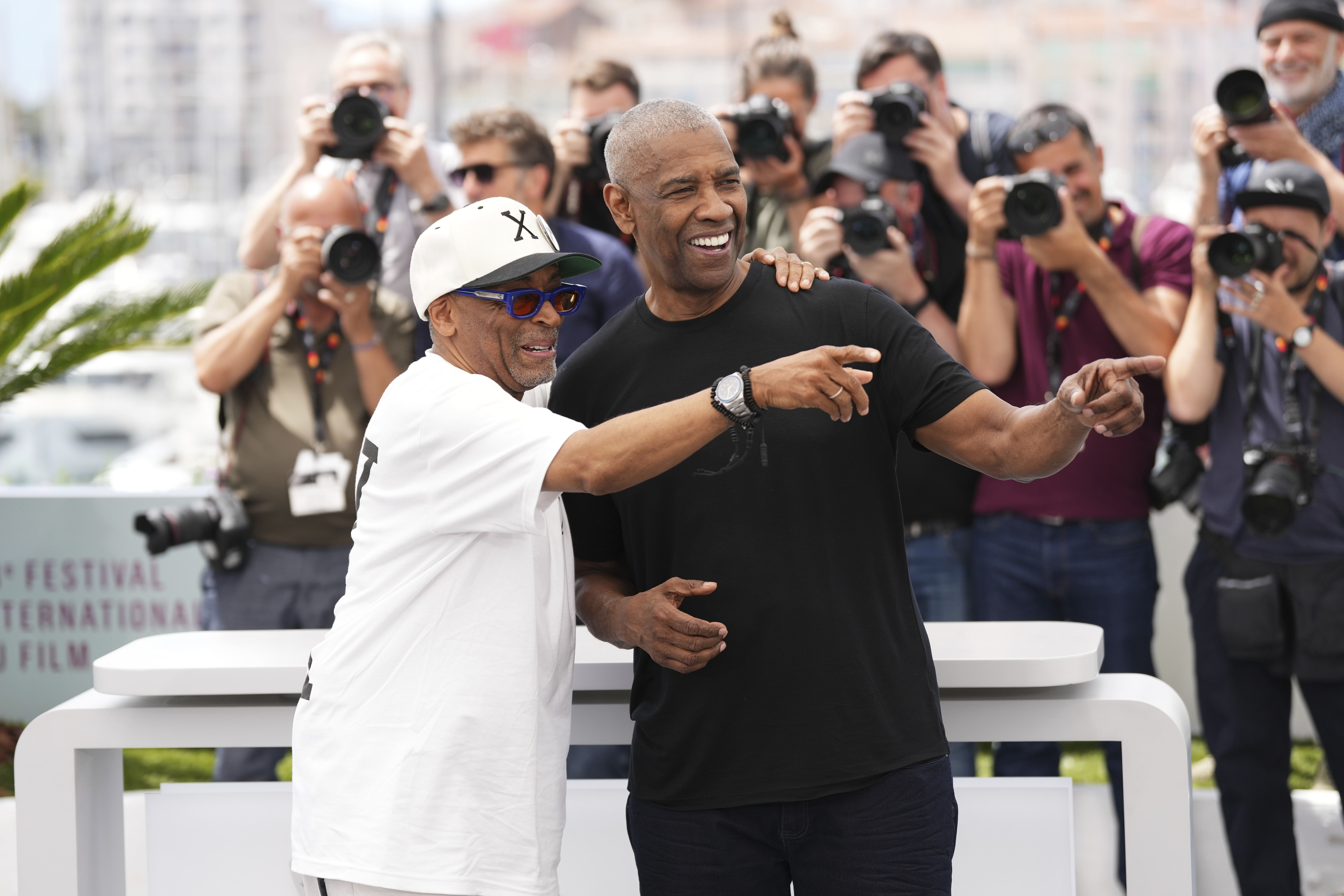 Director Spike Lee, left, and Denzel Washington pose for photographers at the photo call for the film 'Highest 2 Lowest' at the 78th international film festival, Cannes, southern France, Monday, May 19, 2025.