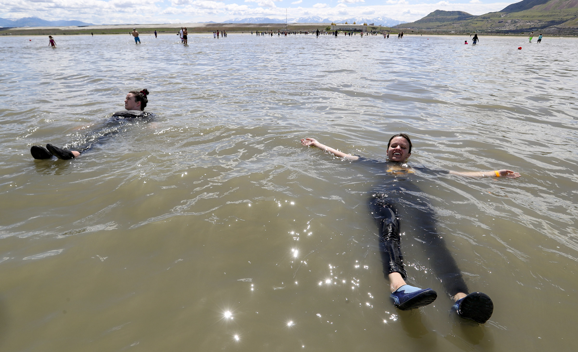 Courtney Pruitt and Sarah Poulsen, of West Bountiful, float in the Great Salt Lake on June 8, 2019.