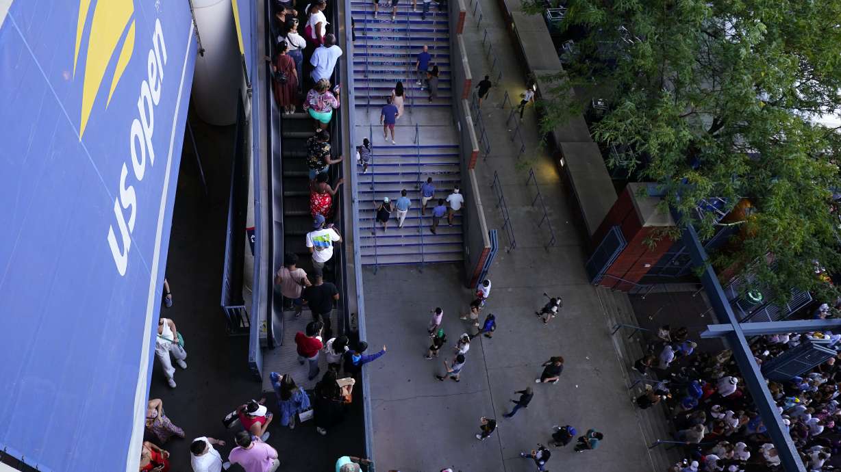 FILE- Fans enter Arthur Ashe Stadium during the second round of the U.S. Open tennis championships, Wednesday, Aug. 31, 2022, in New York.