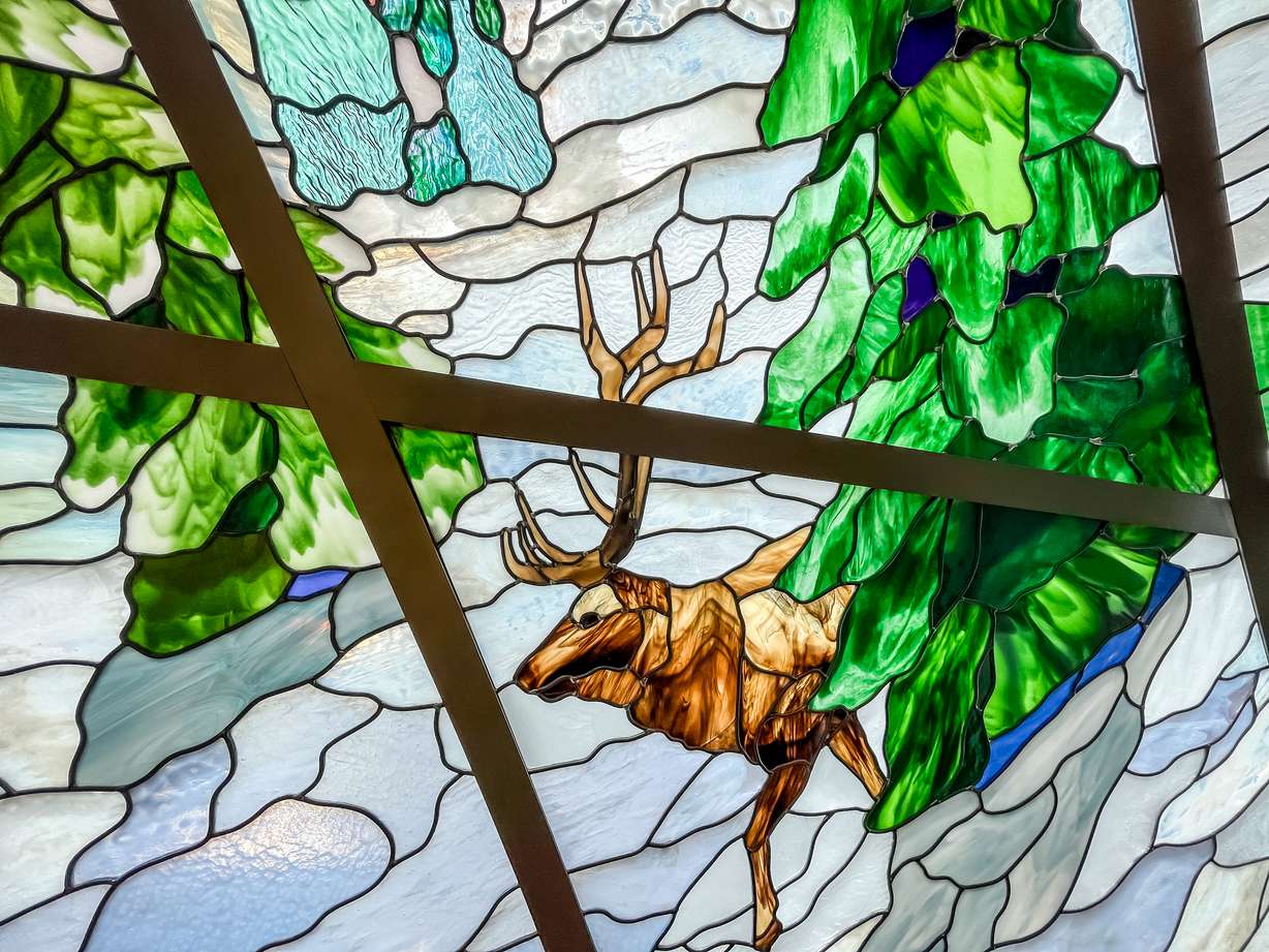 An elk, the state's animal, is depicted in a new stained glass piece atop the North Capitol Building in Salt Lake City.