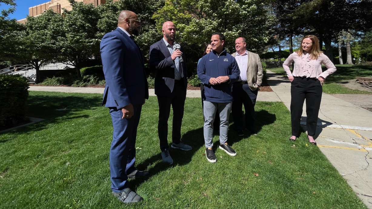 Snowbasin ski resort general manager Davy Ratchford speaks at a press conference Monday in Ogden, pictured here with others aiding in organizing for the 2034 Winter Olympics.