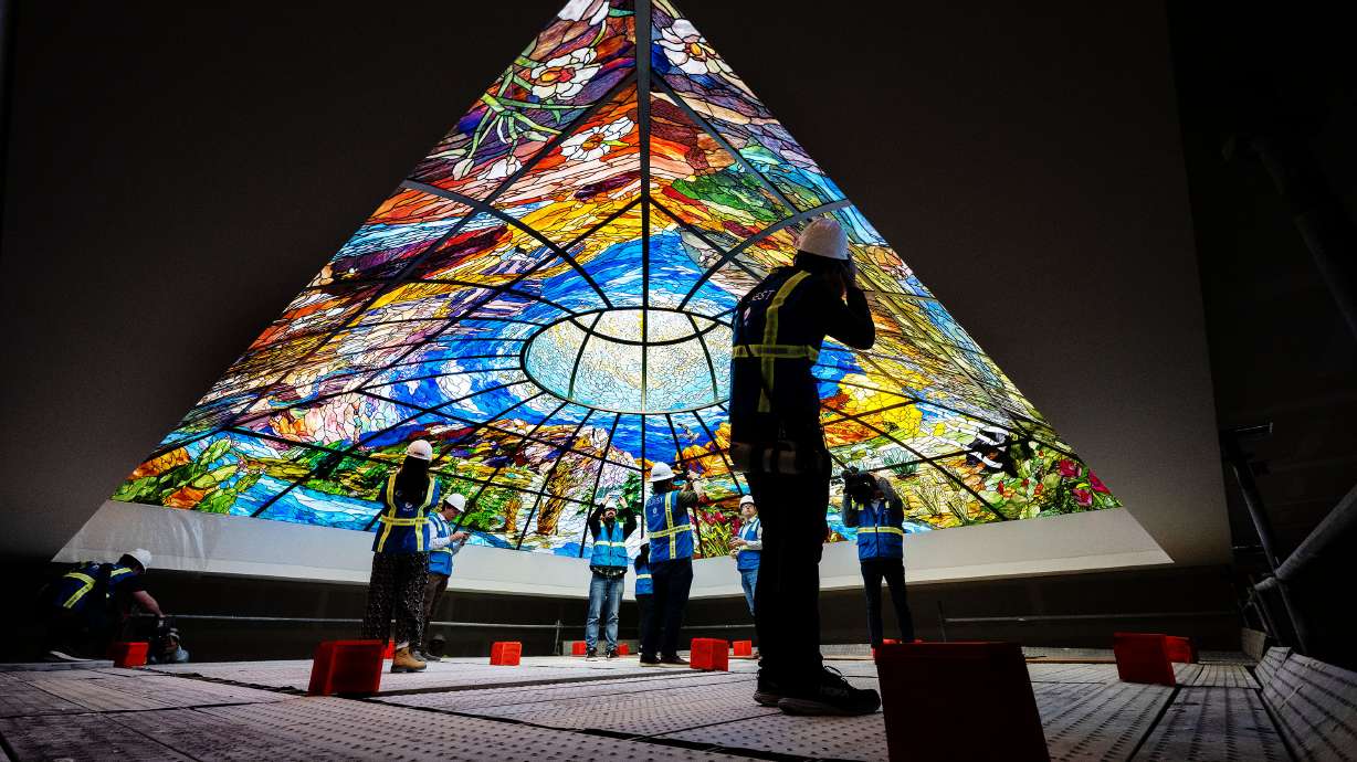 Utah Media members take part in a tour of the stained glass dome in the new state office building at the Capitol in Salt Lake City on Monday. The $1.6 million piece was installed earlier this month.