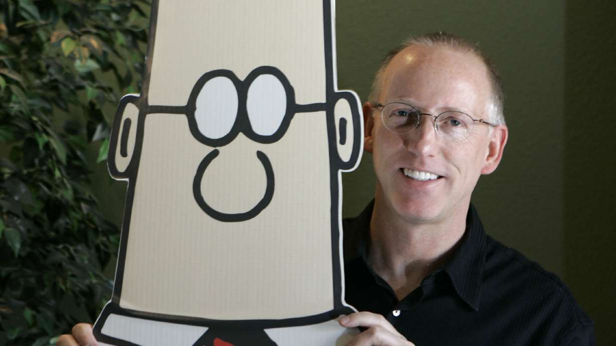 Scott Adams, creator of the comic strip Dilbert, poses with the Dilbert character in Dublin, Calif., Oct. 26, 2006. Adams said Monday that he has been diagnosed with the same aggressive prostate cancer as former President Joe Biden.