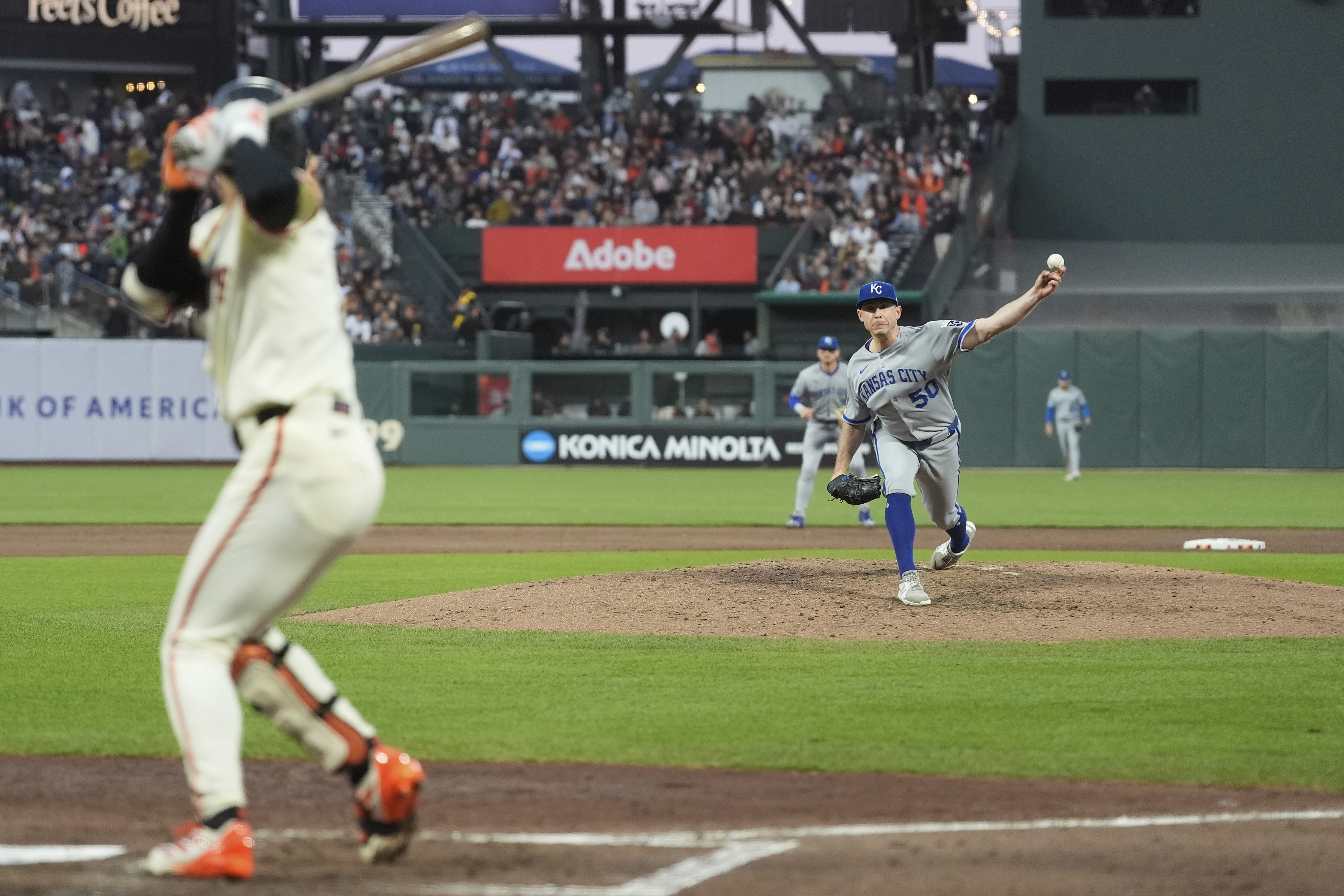 Kansas City Royals pitcher Kris Bubic (50) throws a pitch to San Francisco Giants' Jung Hoo Lee, left, during the sixth inning of a baseball game in San Francisco, Monday, May 19, 2025.