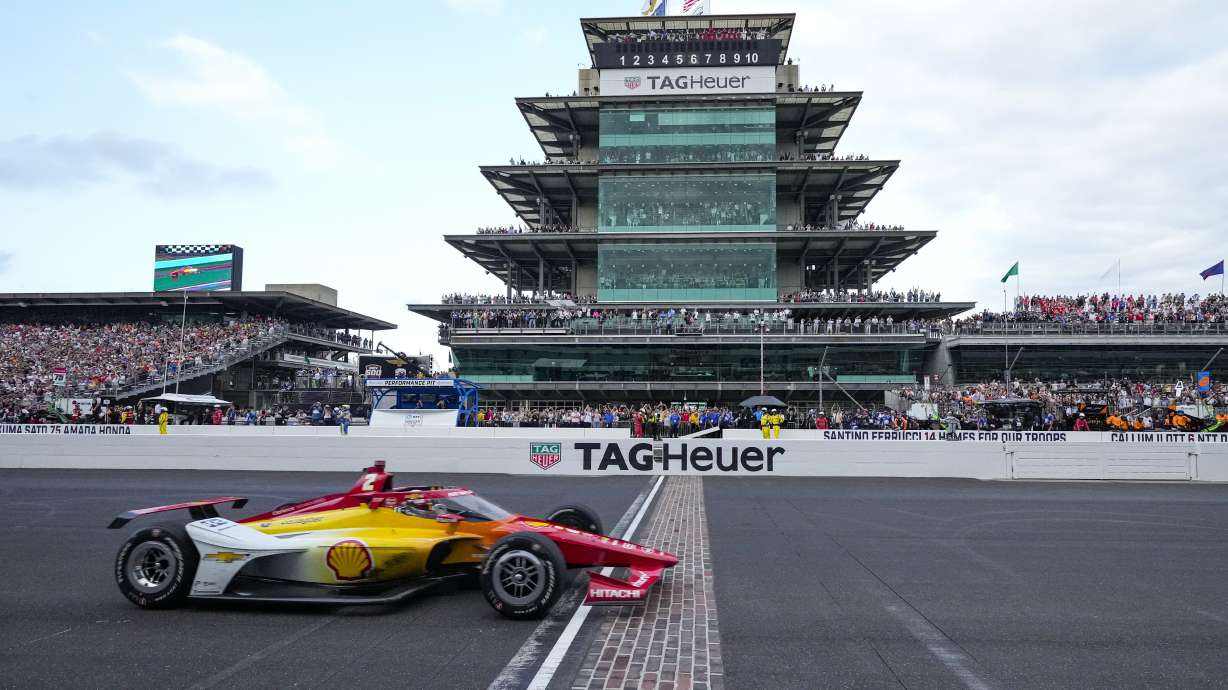 FILE - Josef Newgarden crosses the finish line to win the Indianapolis 500 auto race at Indianapolis Motor Speedway in Indianapolis, Sunday, May 26, 2024.