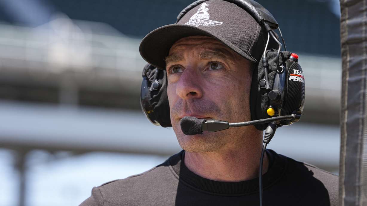 Former Team Penske driver and Indianapolis 500 winner Simon Pagenaud works on the timing stand as a driver coach for Scott McLaughlin during practice for the Indianapolis 500 auto race at Indianapolis Motor Speedway in Indianapolis, Sunday, May 18, 2025.