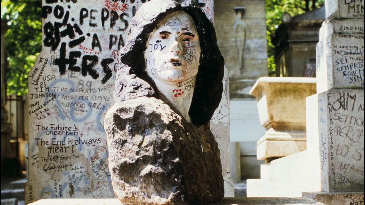 The tomb of U.S. singer and songwriter Jim Morrison in Paris, France, is seen in June, 1985. The sculpture was missing for almost four decades until it was recently recovered.