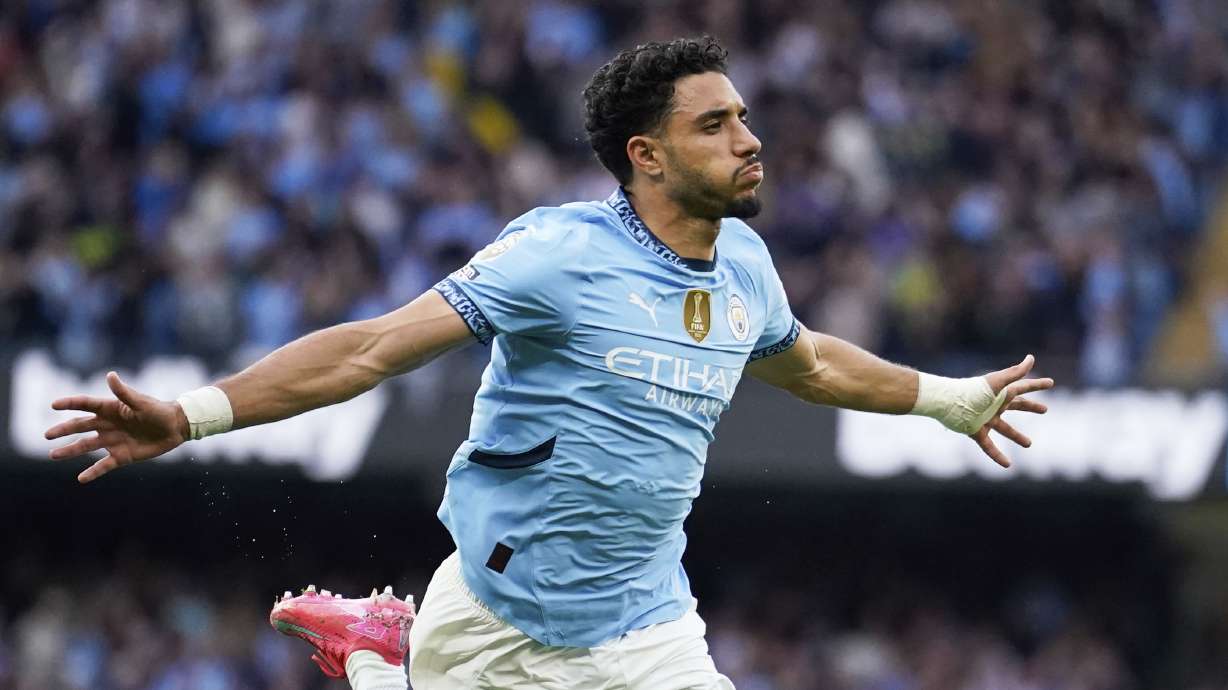 Manchester City's Omar Marmoush celebrates after scoring his side's opening goal during the English Premier League soccer match between Manchester City and Bournemouth at the Etihad stadium in Manchester, England, Tuesday, May 20, 2025.