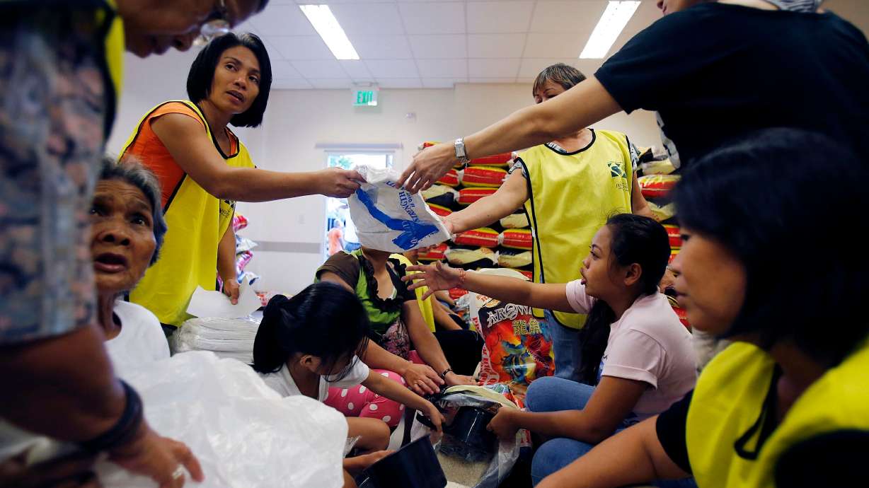 Members of The Church of Jesus Christ of Latter-day Saints, volunteers and missionaries work to prepare relief supplies in Cebu City, Nov. 20, 2013. Secretary of State Marco Rubio said Tuesday the State Department will look to charitable religious organizations as it seeks to adjust foreign aid programs.