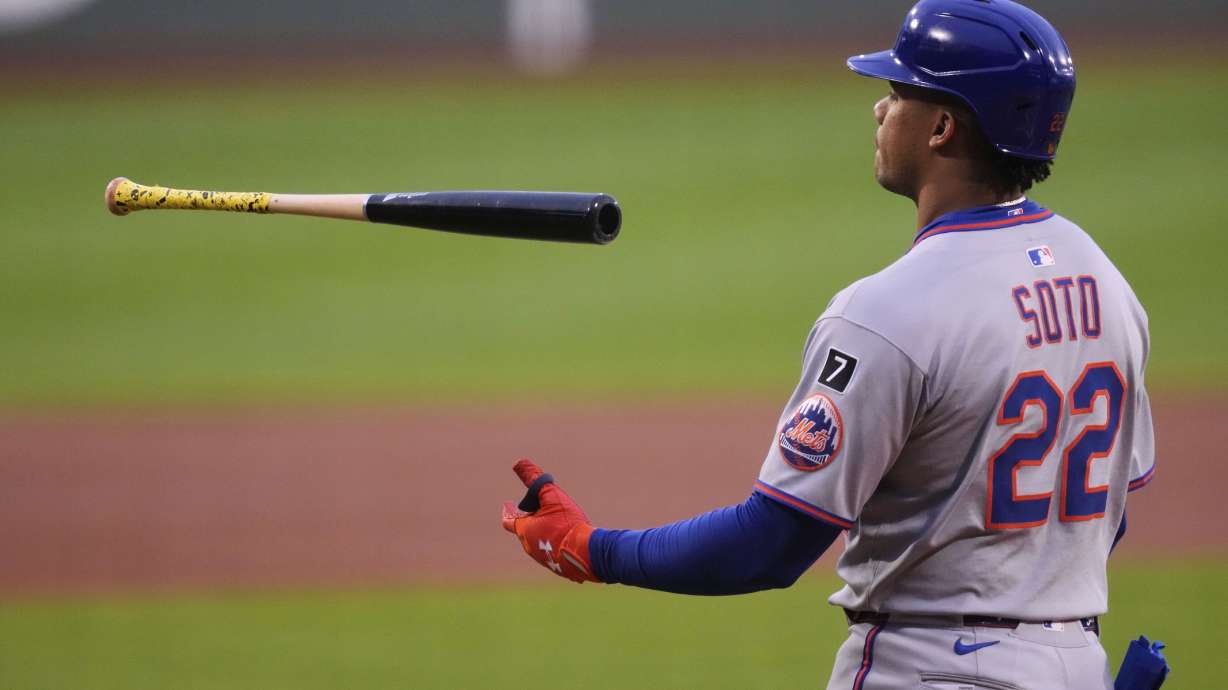 New York Mets' Juan Soto flips his bat after striking out against Boston Red Sox pitcher Walker Buehler during the first inning of a baseball game at Fenway Park, Tuesday, May 20, 2025, in Boston.
