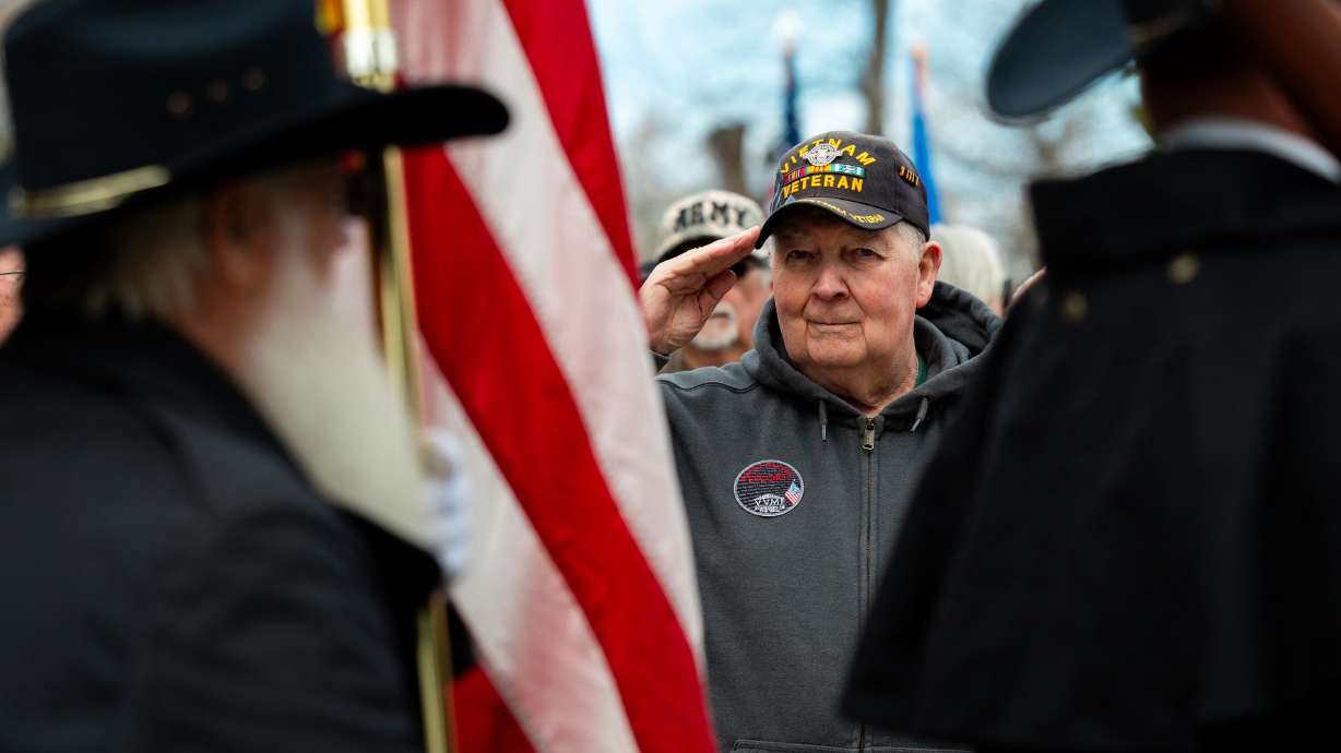 Mike Beard salutes during the posting of the colors during a Vietnam War Veterans Day celebration in Layton on March 29, 2024. A study ranks the Beehive State ranks for its ability to provide a comfortable military retirement.