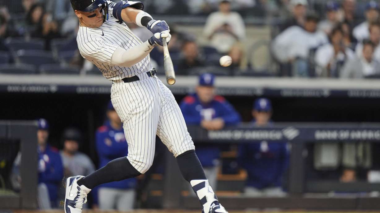 New York Yankees' Aaron Judge hits a single during the fourth inning of a baseball game against the Texas Rangers Tuesday, May 20, 2025, in New York.