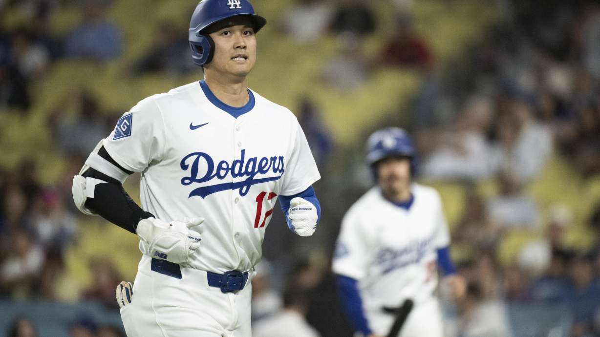 Los Angeles Dodgers' Shohei Ohtani jogs back to the dugout after grounding out during the eighth inning of a baseball game against the Arizona Diamondbacks in Los Angeles, Monday, May 19, 2025.