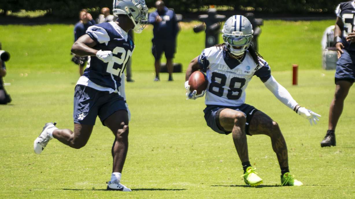 Dallas Cowboys' CeeDee Lamb runs the ball during NFL football practice at the Cowboys' facility, Tuesday, May 20, 2025, in Frisco, Texas.