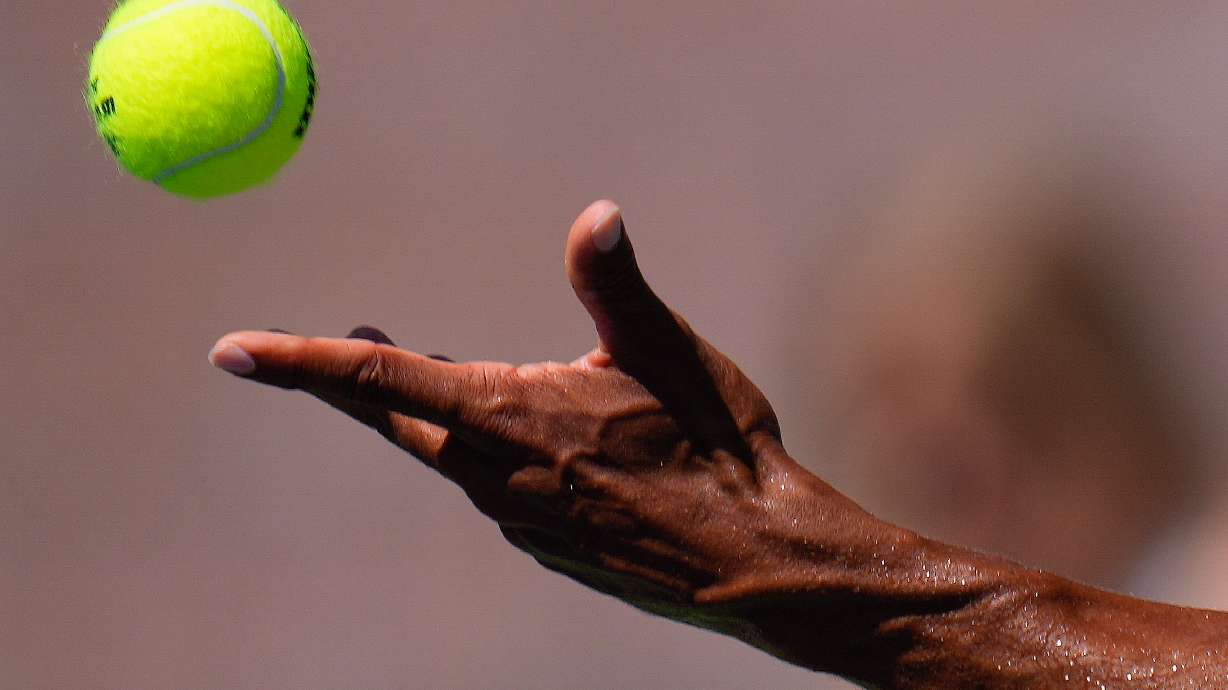 FILE - A tennis ball is tossed in the air, Saturday, Sept. 2, 2023, in New York.