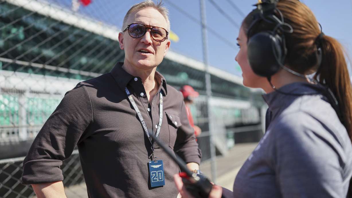 In this image provided by Penske Entertainment Photo, FOX Sports CEO & Executive Producer Eric Shanks speaks with FOX IndyCar pit reporter Georgia Henneberry on May 9, 2025, at the Indy Grand Prix at Indianapolis Motor Speedway in Indianapolis.