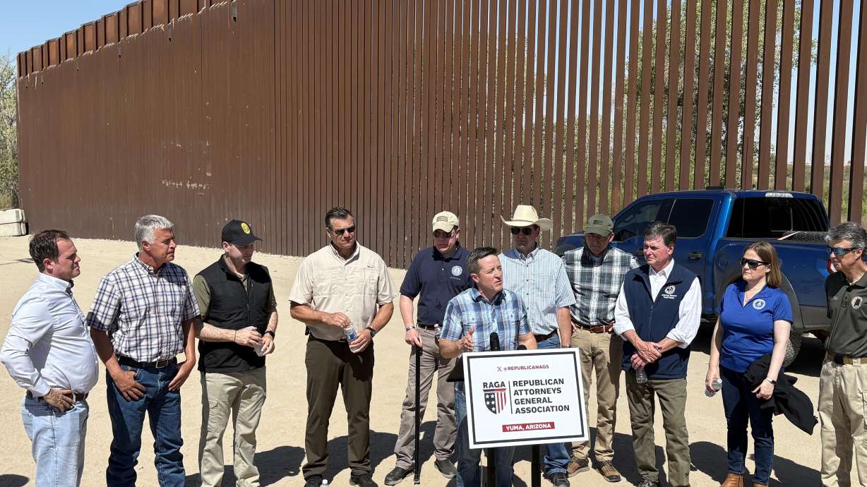 Utah Attorney General Derek Brown speaks to the media along with other Republican attorneys general from across the U.S. in Yuma, Ariz., at the U.S.-Mexico border, Wednesday.