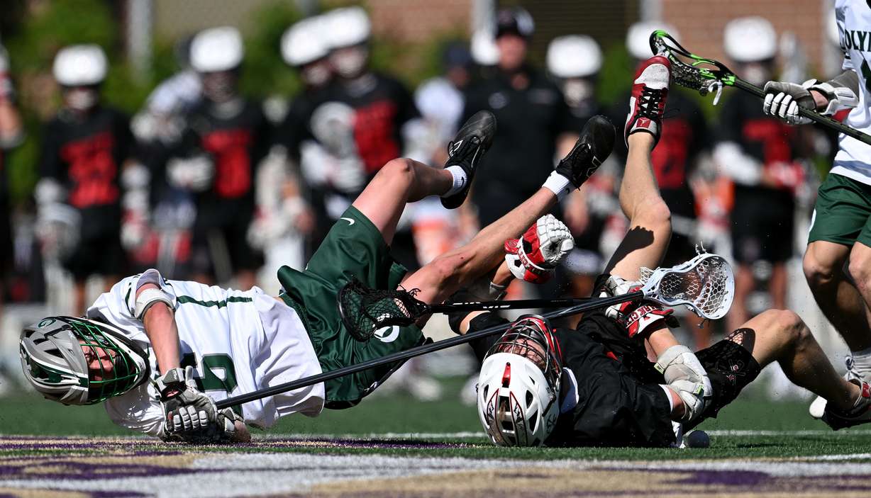 Olympus’ Thomas Ockey and Park City’s Reece Smith tumble over each other as they play in the 4A Boys Lacrosse semifinals at Westminster University in Salt Lake City on Wednesday, May 21, 2025.