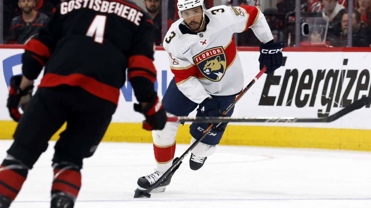 Florida Panthers' Seth Jones (3) states with the puck against the Carolina Hurricanes during the first period of Game 1 of the NHL hockey Stanley Cup Eastern Conference finals in Raleigh, N.C., Tuesday, May 20, 2025.