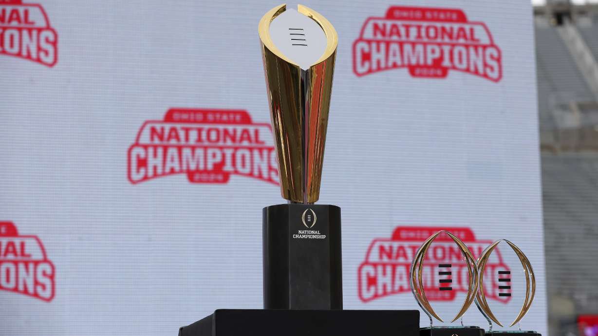 FILE - The College Football Playoff National Championship Trophy on display before the Ohio State Buckeyes National Championship celebration at Ohio Stadium in Columbus, Ohio, Sunday, Jan. 26, 2025.
