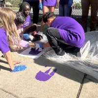 Dinosaur tracks showing students the safe way to walk, bike to school