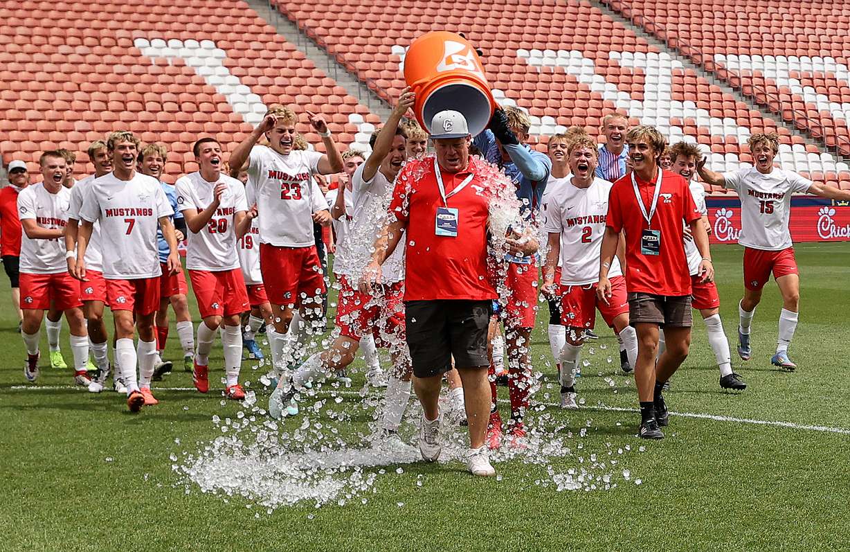 Crimson Cliffs players celebrate winning the boys 6A state soccer championship game against Dixie at America First Field in Sandy on Thursday, May 22, 2025. Crimson Cliffs won 3-0.