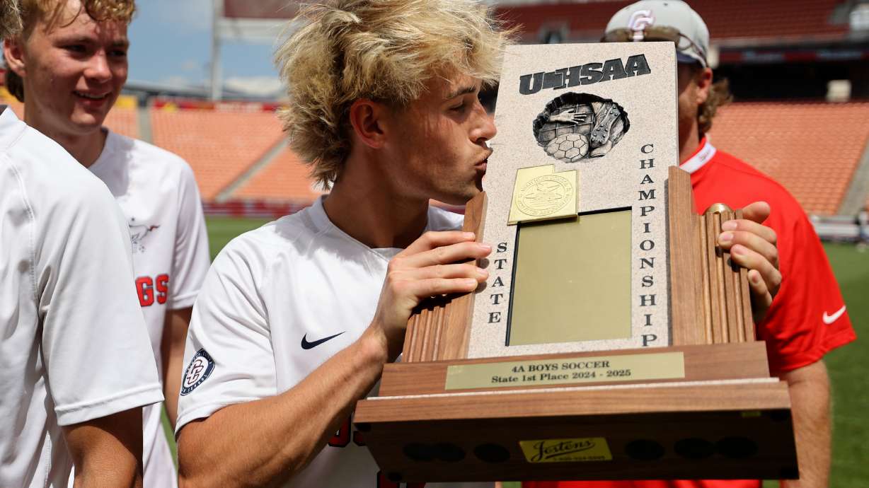 Crimson Cliffs players celebrate winning the boys 6A state soccer championship game against Dixie at America First Field in Sandy on Thursday, May 22, 2025. Crimson Cliffs won 3-0.
