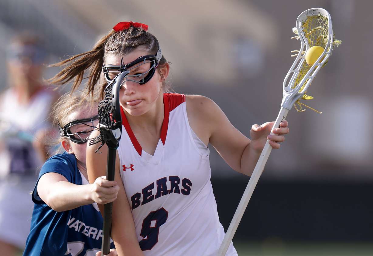 Bear River’s Shelby Wilkinson drives past Waterford’s Kenzie Sevy during the 4A girls lacrosse state championship game against Waterford at Zions Bank Stadium in Herriman on Thursday, May 22, 2025.